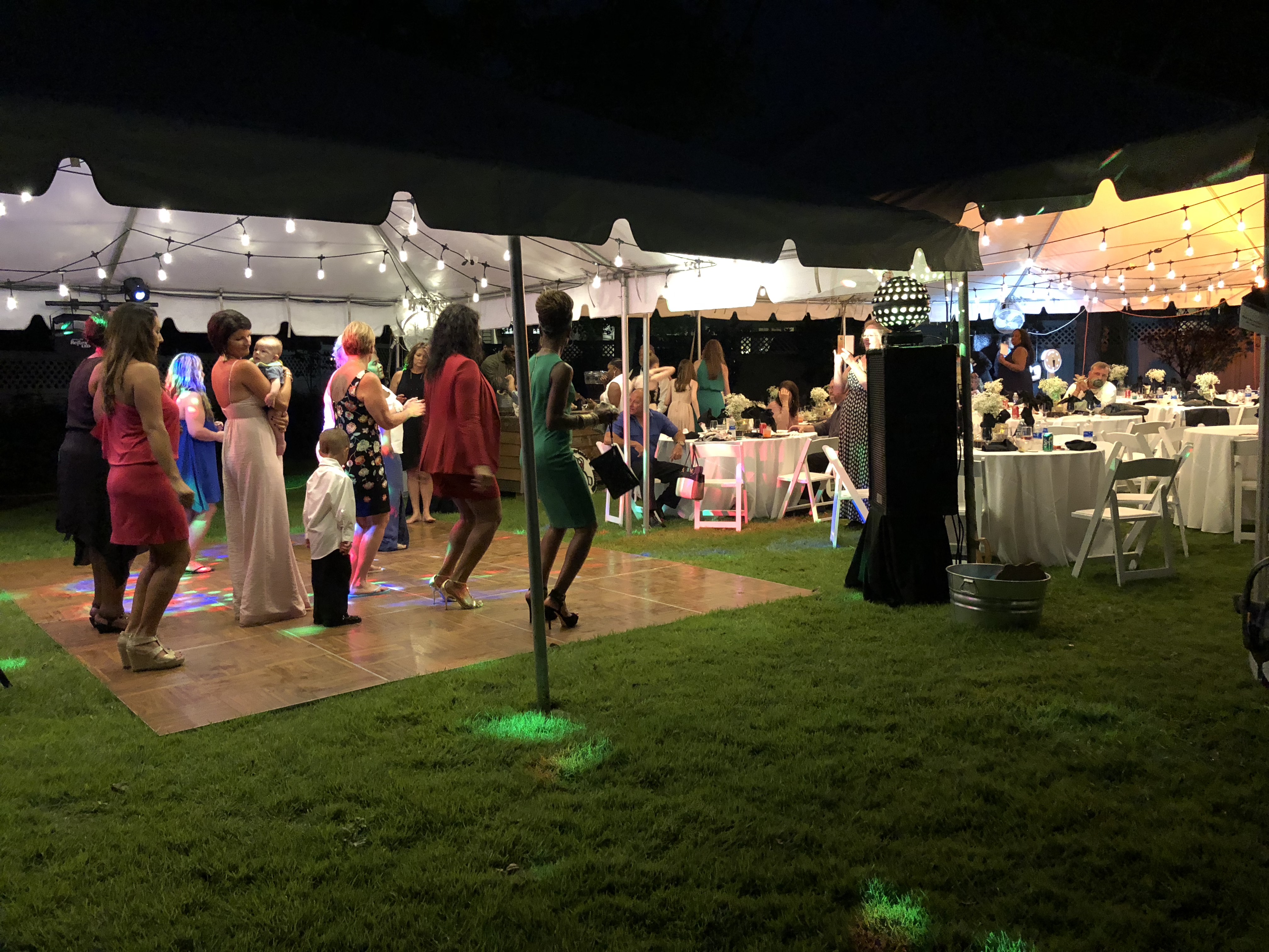 Image of people dancing under the tent