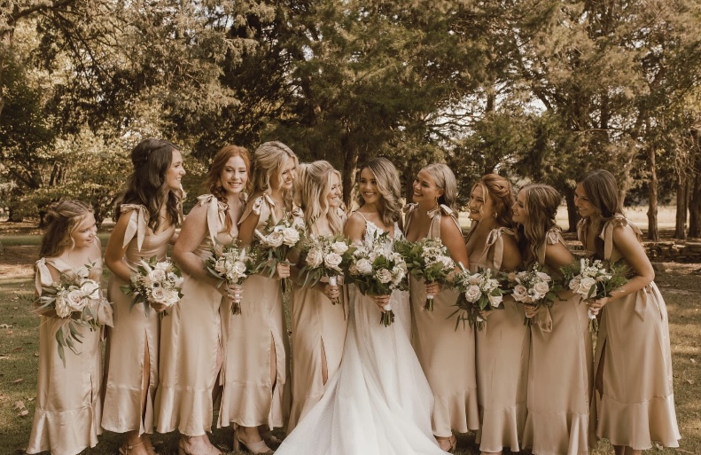 Group of women holding flowers