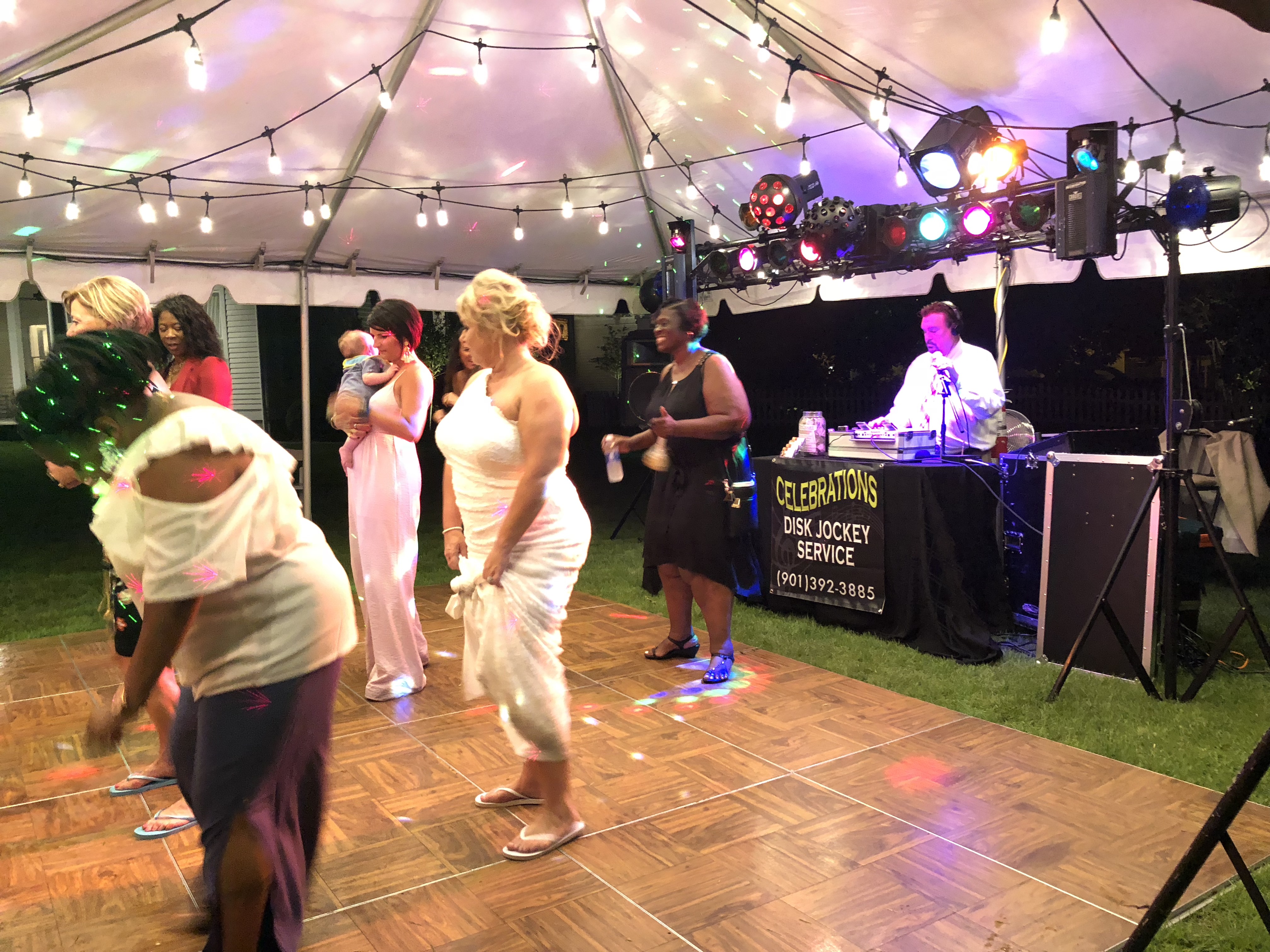 Women dancing in front of DJ